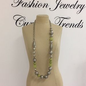 Long silver tribal pattern with peridot accents